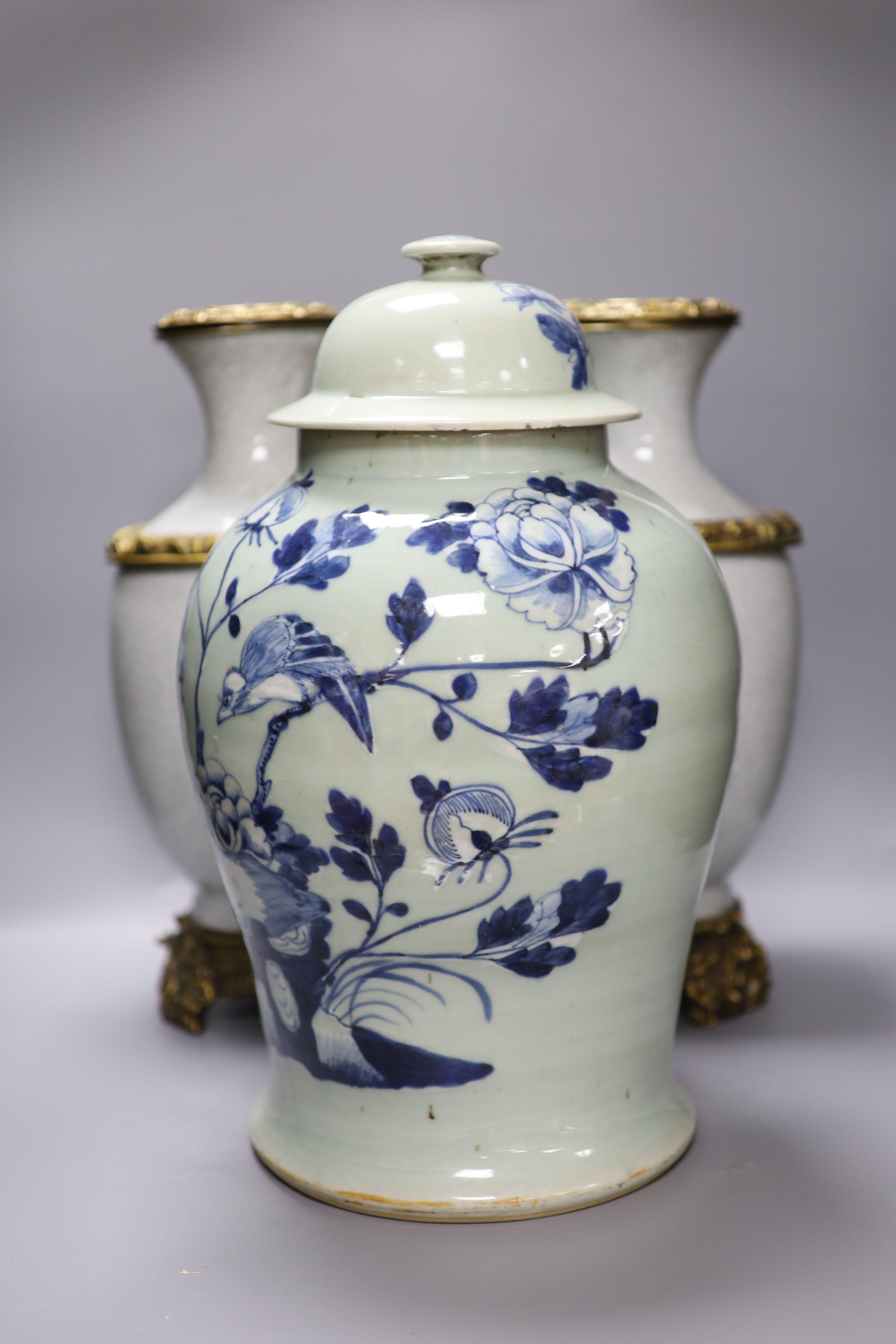 A pair of Chinese crackleglaze vases and a blue and white vase and cover, height 43cm